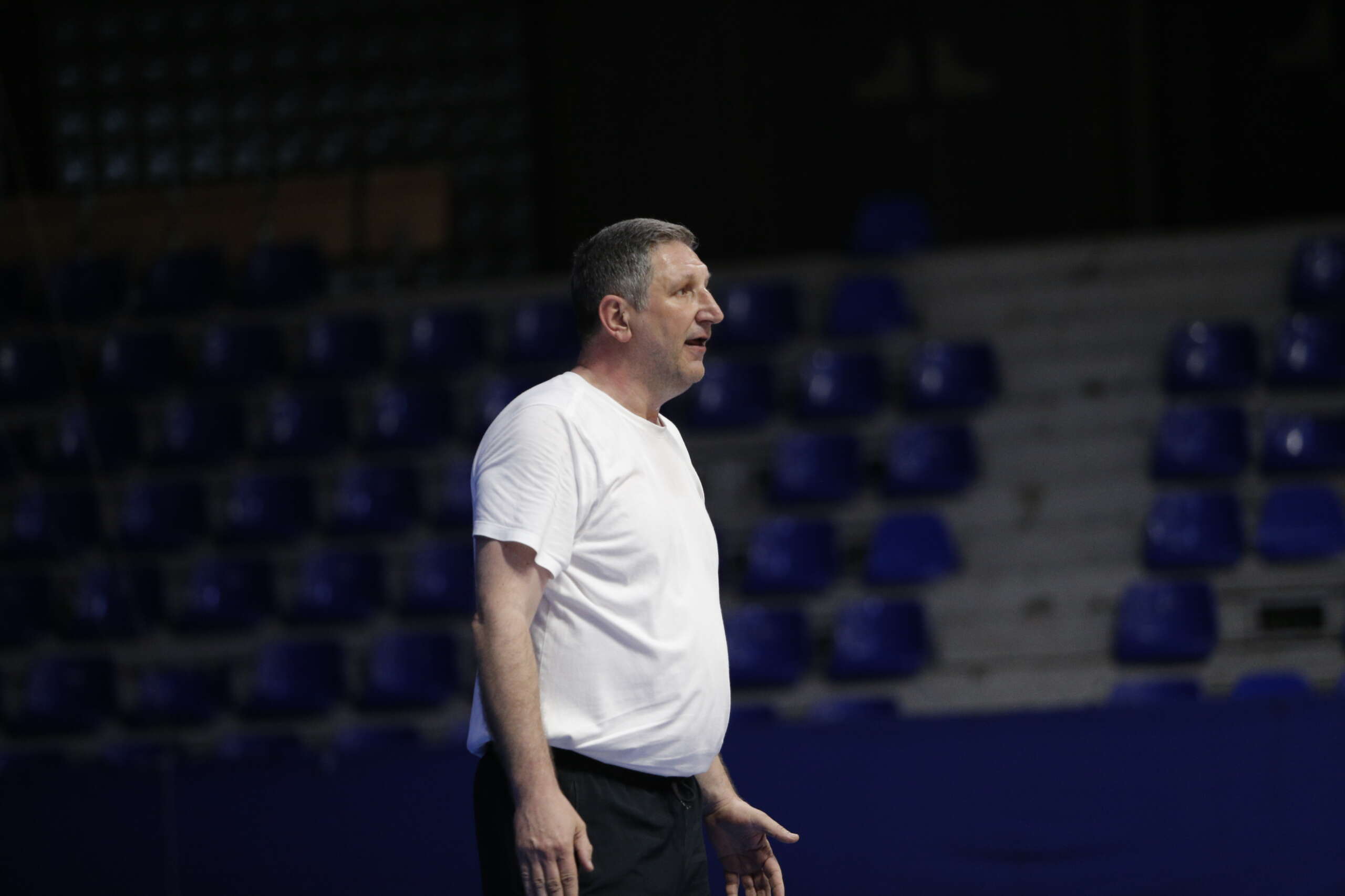 Side profile of Verim Zherka looking on during a match